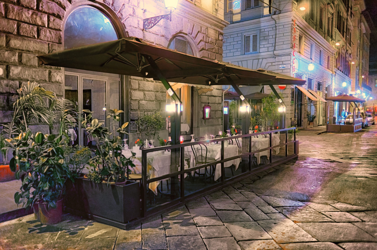 outdoor restaurant umbrellas night