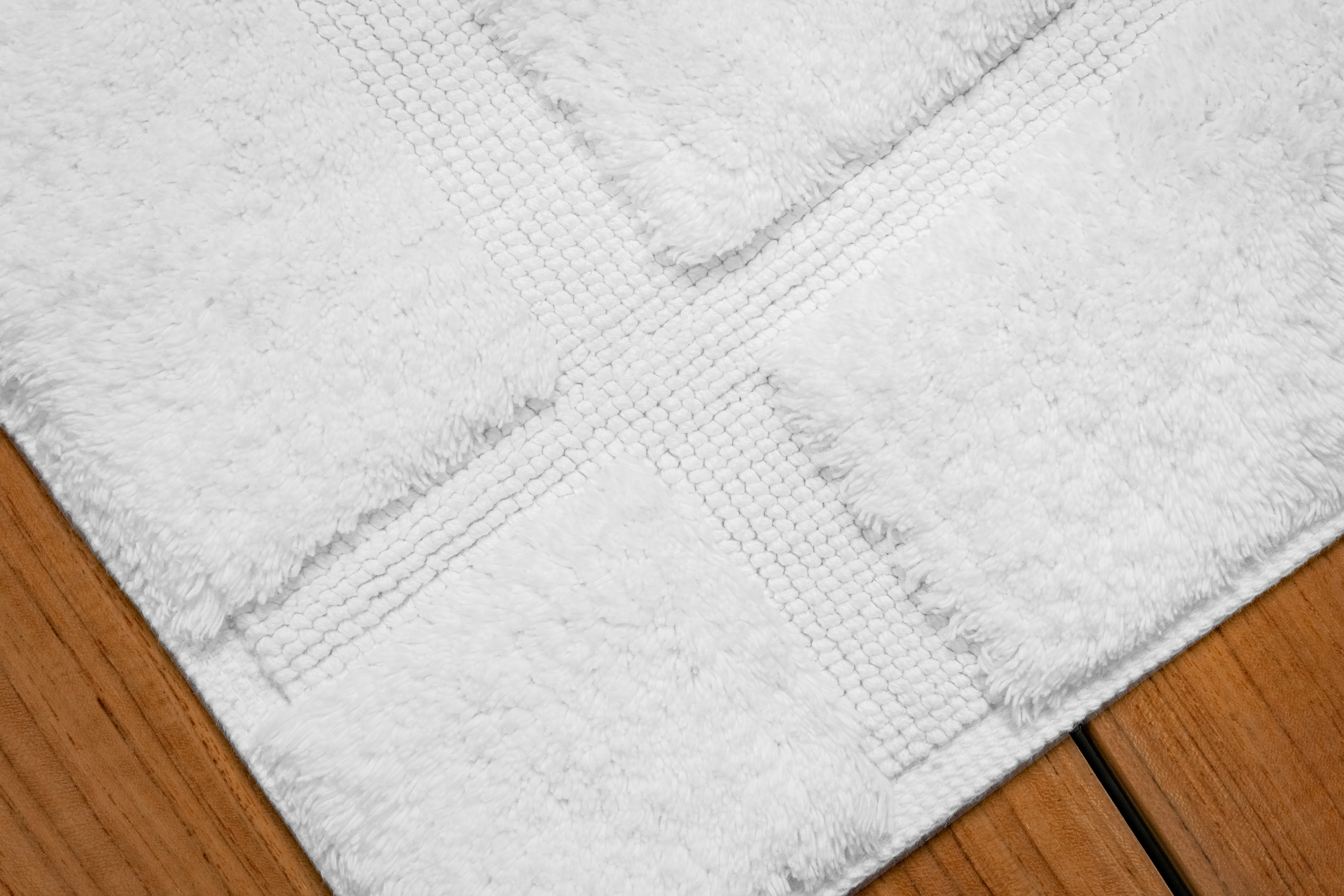 Elevate your bathroom with the indulgent comfort of Riposo Collection bathrugs, featuring exquisite design and plush textures.